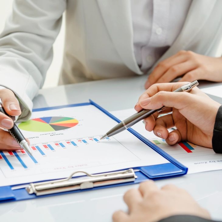 Business meeting with charts and graphs